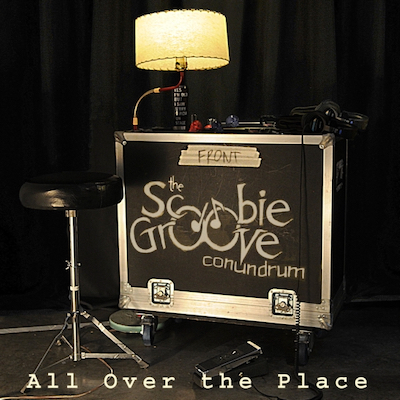 Patrick J McCool - The Scoobie Groove Conundrum - All Over The Place album cover shows a photo of the recording studio